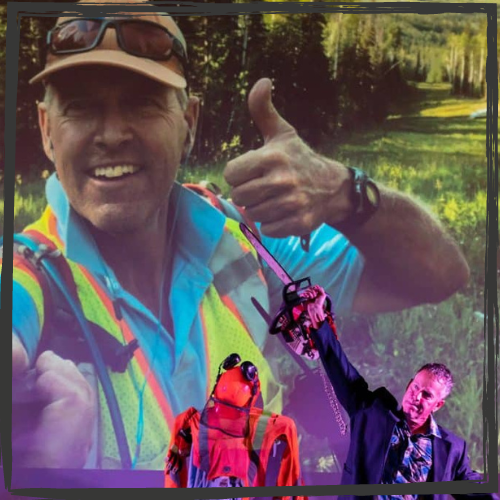 A white man in a suit jacket & plaid shirt holds up a chainsaw & stands next to his logging clothes; the background is a photo of him giving a thumbs up