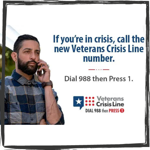 Photo of a man w/a beard holding a phone to his ear. On right: "If you're in crisis, call the new Veterans Crisis Line number" w/info below